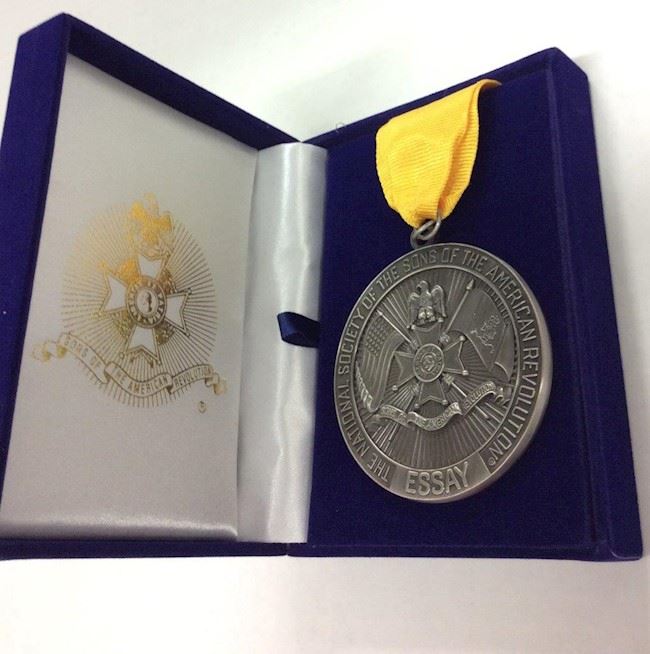 Essay contest medal with yellow ribbon in blue SAR box